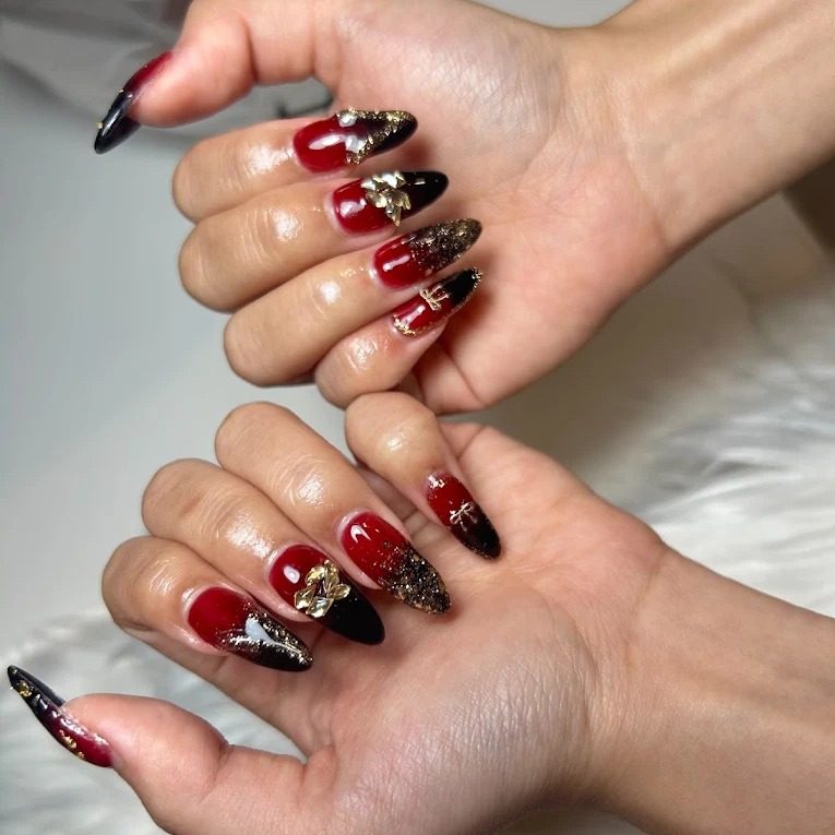 Red and black gel nail art at PAYA nail salon, Bangkok